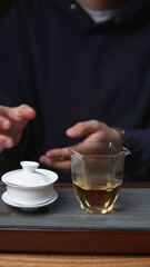 The Detailed Tea Brewing Process Using a Gaiwan and a Glass Cup for Enjoyment and Wellness. Media