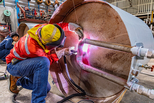 Industrial welding fabricated pipeline is tank stainless steel repair construction work in factory, Welding process by Gas Tungsten Arc Welding