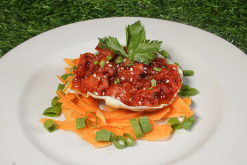A plate of delicious stir-fried beef. Spicy sauce stir-fried beef dish
