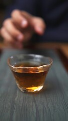 An Intimate CloseUp of a Beautiful Tea Cup Brimming with Rich Amber Liquid Inside. Media