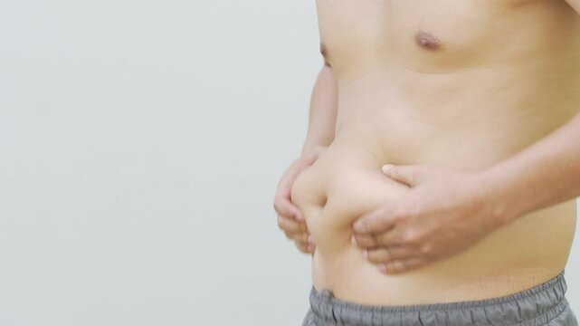 Fat man with big bellies and high fat the result of drinking beer every day.