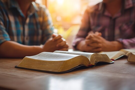 Christian couple or group reading study the bible together and pray at a home or Sunday school at church. concept studying the word of god.