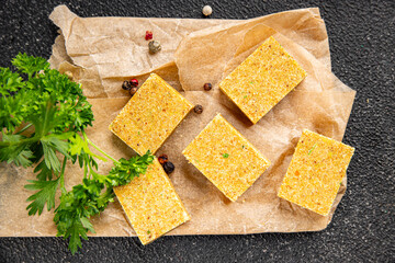 Broth cube vegetable, meat broth concentrated broth chicken, pork, beef meat natural food fresh dish on the table rustic food top view copy space