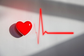 Striking heart and heartbeat line graphic, featuring a vibrant red heart and dynamic red pulse...