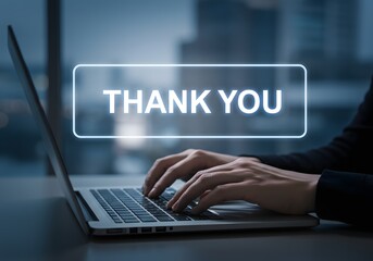 Person Typing Thank You on Laptop Computer in Office