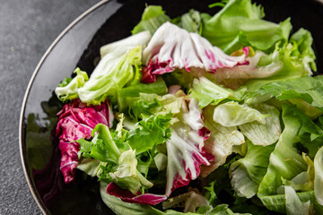 Salad mixed leaves iceberg, batavia, lettuce, radicchio, romano, frisee appetizer vegetables dish...