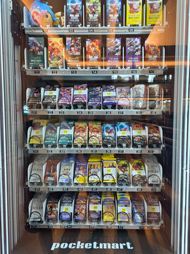 Kuala Lumpur, Malaysia &ndash; Mar 31, 2025: A vending machine by Pocketmart featuring a variety of trading card game packs and collectibles, including One Piece, Dragon Ball, Disney Lorcana, and Pixar.