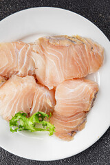 Raw fish fillet white fish seafood appetizer dish organic product fresh tasty gourmet food background on the table rustic food top view copy space pescetarian diet