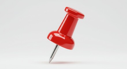 Oversized red pushpin with glossy finish on white background for minimalist office supply design