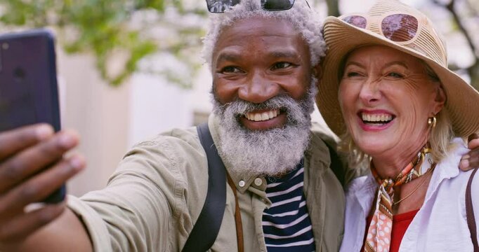 Selfie, hike and senior couple with love, kiss or funny with happiness, hug or romance. Outdoor, interracial or mature woman with elderly man, travel or embrace with nature, picture or capture moment