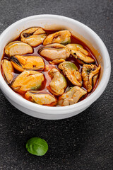 Mussels canned seafood appetizer dish organic product fresh tasty gourmet food background on the table rustic food top view copy space keto paleo pescetarian diet vegetarian food