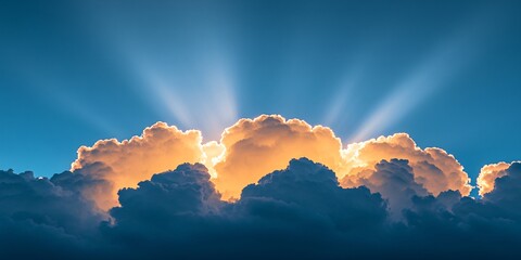 stunning sunrise cloudscape with sun rays breaking through bright blue sky