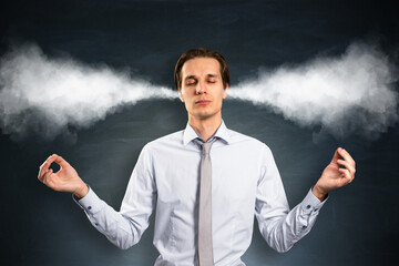 Calm businessman meditating with steam coming out of ears symbolizing stress relief and emotional...