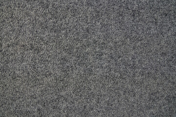 Soft grey felt material. The surface is made of felt fabric with a gray abstract background texture. With space to copy. High quality photo