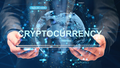Businessperson holding tablet with digital cryptocurrency interface and global blockchain network concept on abstract cyberspace background.