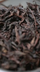 A Close Up Shot of Dried Black Tea Leaves, Highlighting Their Rich Aroma and Color. Media