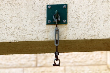 A metal bolt with threads for connecting and fastening parts together.