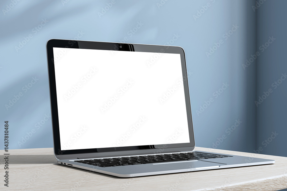 Poster laptop mockup with blank white screen on modern desk and soft blue wall background for technology or