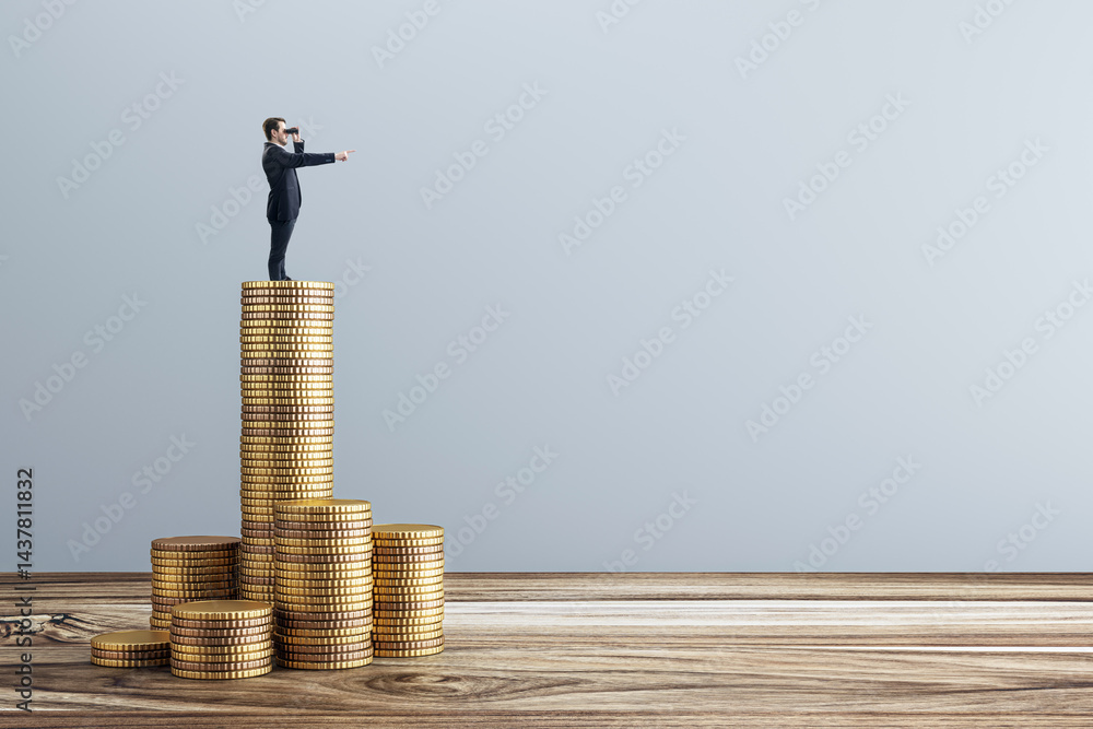 Poster businessman looking ahead with binoculars while standing on tall stack of coins, symbolizing financi