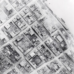 Obraz premium urban street aerial view with long straight road lined by buildings under clear sky, blending architectural sketches and realistic city scenes, modern cityscape with planning construction and design e