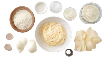 Overhead shot of ingredients including flour, milk, eggs, and pasta in containers ready to use