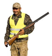 Hunter man in camouflage with a gun during the hunt in search of wild birds or game. Autumn hunting...