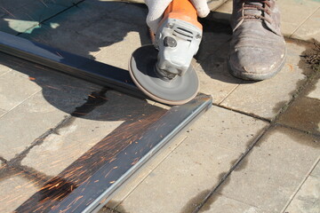 metal repair work with a grinder with beautiful sparks	
