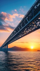 Naklejka premium Steel arch bridge spanning serene water at sunset.