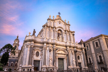 Facade of the Baroque Cathedral Basilica of Saint Agatha in Catania, Sicily, Italy, in the golden...