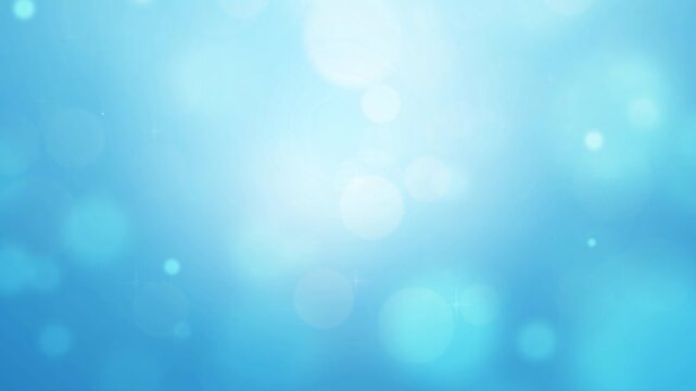 青　玉ボケ　ループ動画　キラキラ　パーティクル　ふわふわ　光る　爽やか　丸　シンプル　Abstract glowing blue background.Bokeh lights.Loop video.