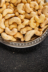 Cashew nuts natural superfood dish organic product fresh tasty gourmet food background on the table rustic food top view copy space