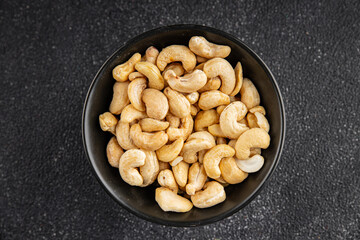 Cashew nuts natural superfood dish organic product fresh tasty gourmet food background on the table rustic food top view copy space