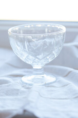 Elegantly crafted glass dessert cup, perfect for showcasing ice cream or parfaits. A timeless piece to elevate any dessert experience.