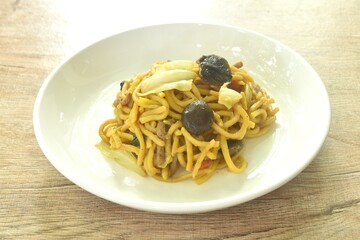 fried yakisoba Japanese noodles and cabbage with mushroom on plate