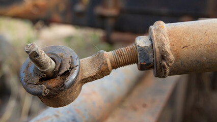 rusty tie rod end with damaged dust cover