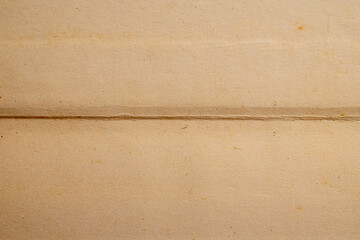 Old folded brown paper texture background
