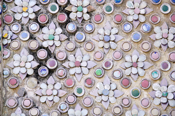 Colorful floral mosaic pattern with glossy round tiles and petals