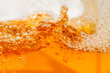 Close up bright orange Oil or beer splash texture and nature waves, Beautiful waves curve and...