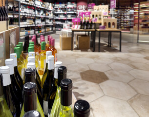 defocused alcohol (wine, champagne, liquor, whiskey) on store shelves