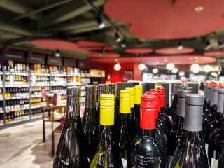defocused alcohol (wine, champagne, liquor, whiskey) on store shelves