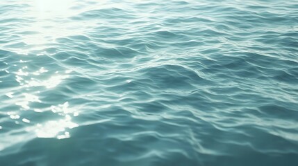 Obraz premium Gentle ocean waves reflecting sunlight.