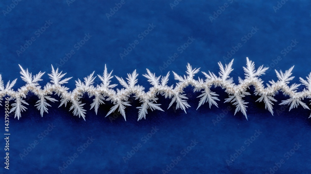 Poster Delicate frost patterns form intricate designs along the edges of a dark blue space, showcasing nature's beauty during the winter season with ample copy space