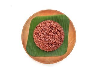 Red rice on wooden plate isolated on white background 