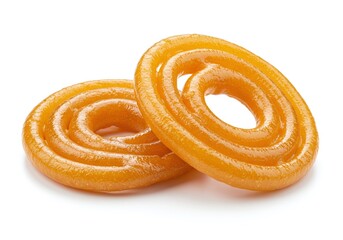 Fototapeta premium Two jalebi sweets, a popular dessert, are displayed isolated on white background