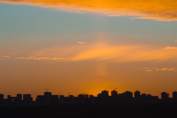 Urban Skyline Silhouette at Sunset with Colorful Sky and High-rise Buildings.