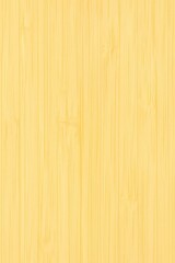 Fototapeta premium Light bamboo texture with subtle vertical grain patterns, creating a warm and natural surface