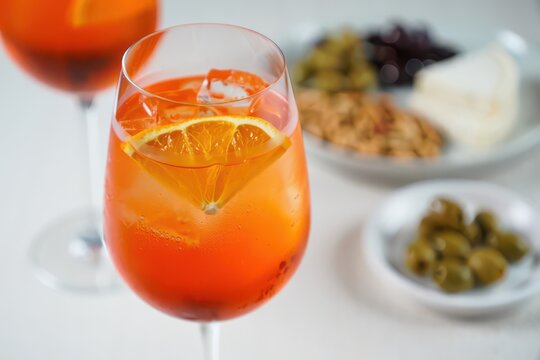 Refreshing Spritz Cocktail with Orange Slice and Ice Cubes