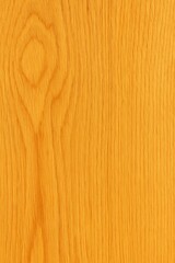 Naklejka premium A smooth golden oak wood texture with fine vertical grain lines and a warm, natural finish.