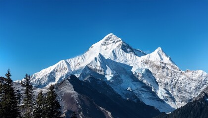 Naklejka premium majestic snow capped mountain peak soaring against a clear blue sky