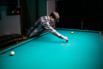 Man gets ready for night pool game